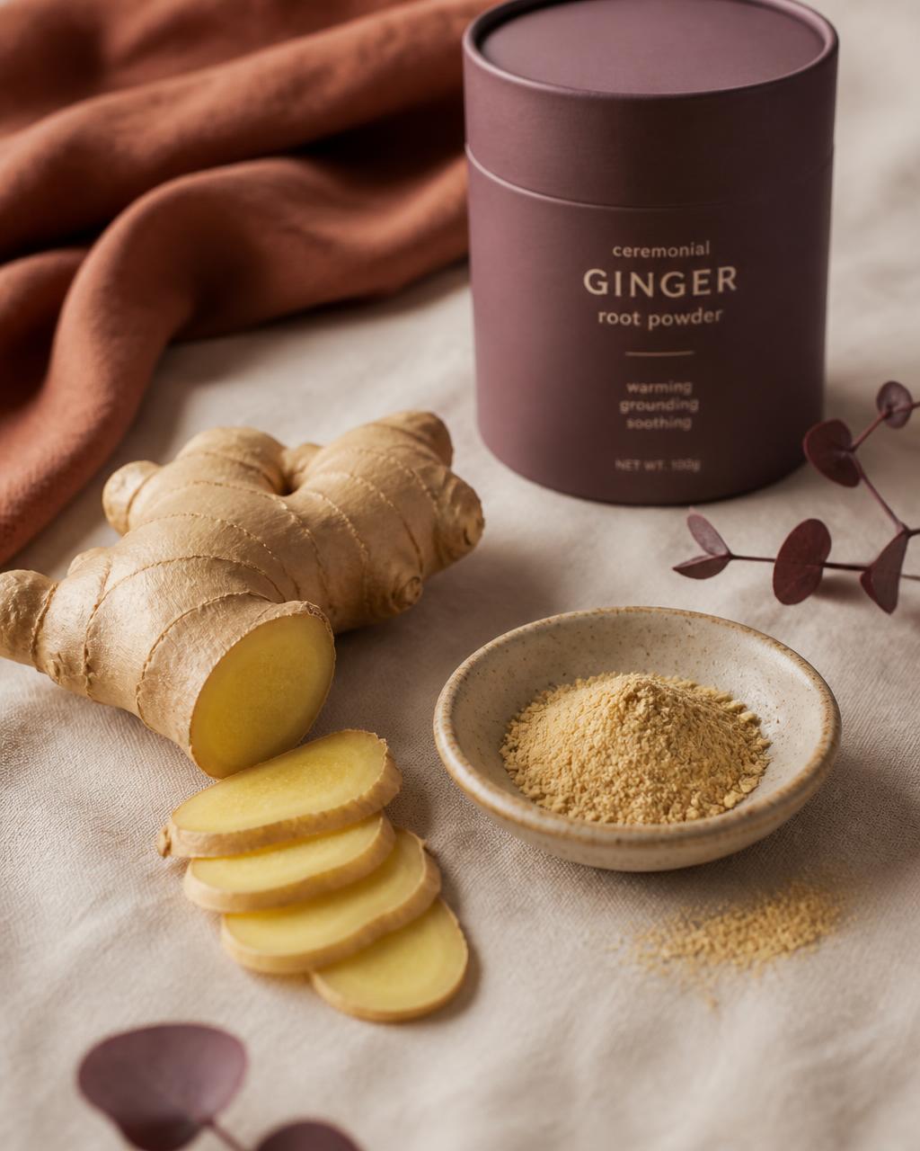 Ginger root, slices and ground ginger powder arranged on natural linen